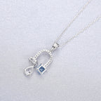 Collier fer à cheval en topaze bleue