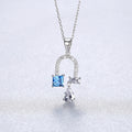 Collier fer à cheval en topaze bleue