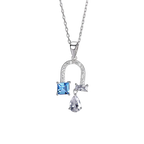 A silver pendant necklace featuring a small square blue gemstone and a teardrop-shaped clear gemstone, set on a delicate silver chain 