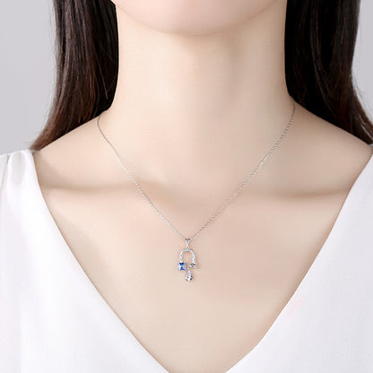 Blue Topaz Horseshoe Necklace
