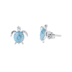 Turtle-shaped earrings with blue stone on a white background, featuring the EIFFIE brand.