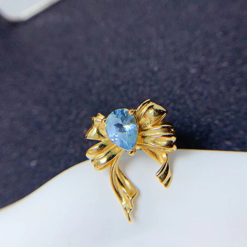 Bague nœud papillon en topaze bleue