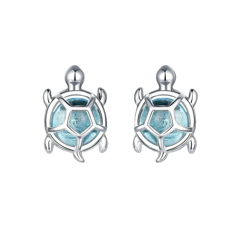 Turtle-shaped earrings with blue center and silver outline on a white background, featuring the brand 'EIFFIE'.