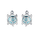 Turtle-shaped earrings with blue center and silver outline on a white background, featuring the brand 'EIFFIE'.