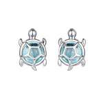 Turtle-shaped earrings with blue center and silver outline on a white background, featuring the brand 'EIFFIE'.