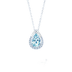 A teardrop-shaped pendant necklace featuring a light blue gemstone surrounded by a silver halo, suspended from a silver chain against a dark blue gradient background. 