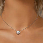 Silver necklace with a diamond pendant on a model