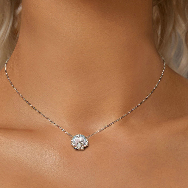 Silver necklace with a diamond pendant on a model