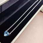 Amour romantique - Collier cœur en topaze bleue serti de pierres en pavé