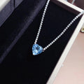 Amour romantique - Collier cœur en topaze bleue serti de pierres en pavé
