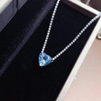 Amour romantique - Collier cœur en topaze bleue serti de pierres en pavé