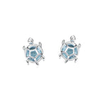 Silver turtle-shaped earrings with blue accents on a white background