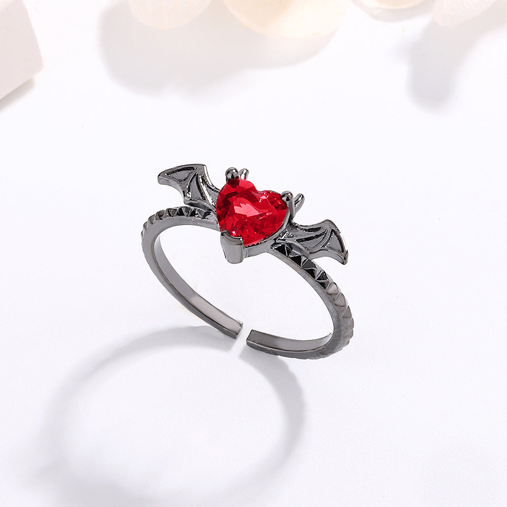 Anillo ajustable gótico rojo con ala de corazón 