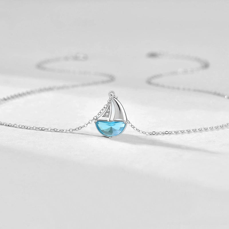 Collar de topacio con gemas y diseño de barco de olas