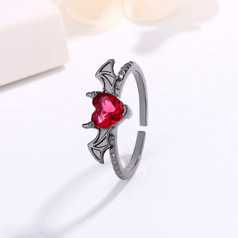 Anillo ajustable gótico rojo con ala de corazón 