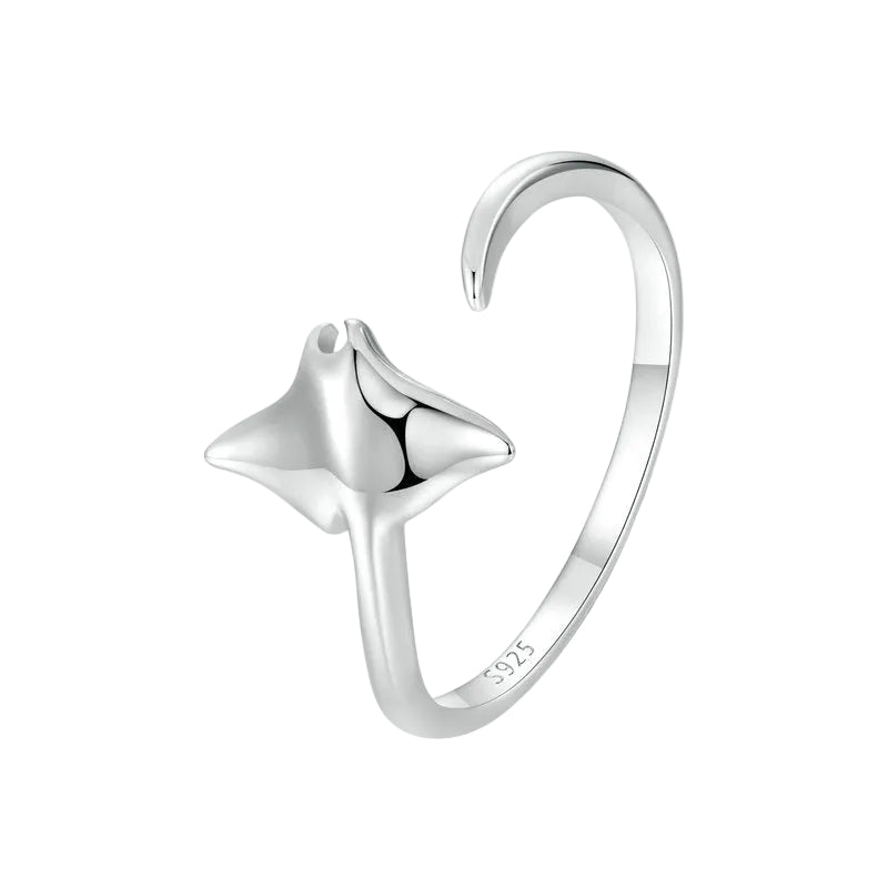 Silver ring with a star design on a white background