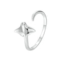 Silver ring with a star design on a white background