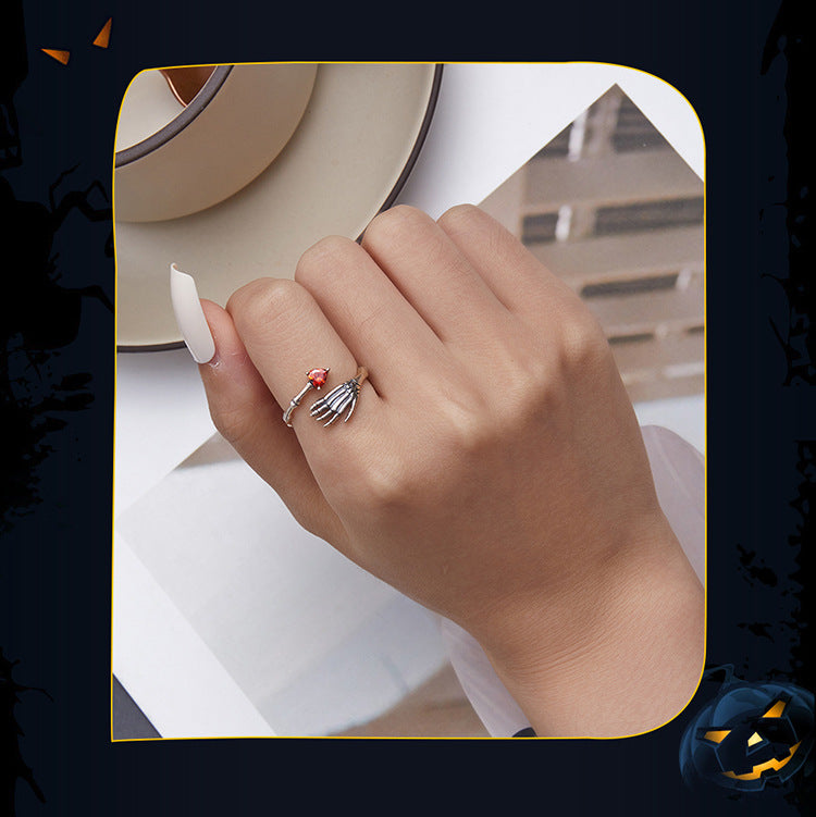 Anillo ajustable de plata con calavera, mano y corazón 