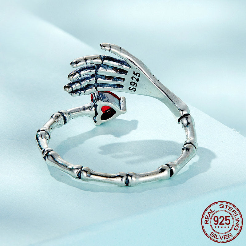 Anillo ajustable de plata con calavera, mano y corazón 